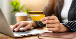 woman with laptop and credit card