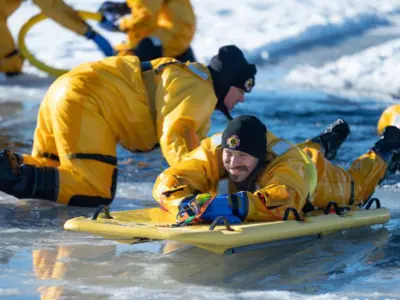 two guys on ice training for technical water rescue